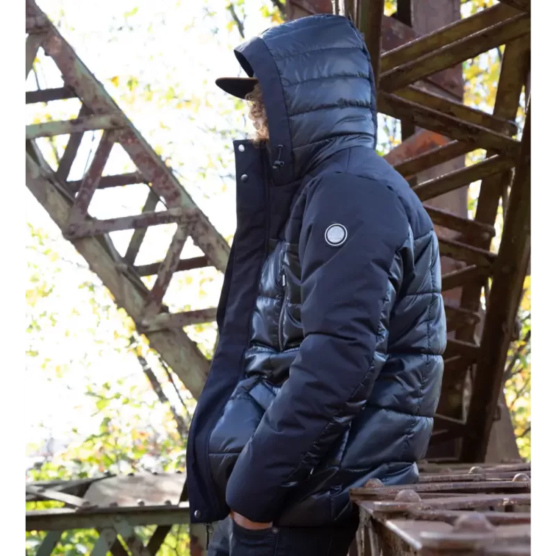 Our model wears the winter jacket SQUARE, color black, side view