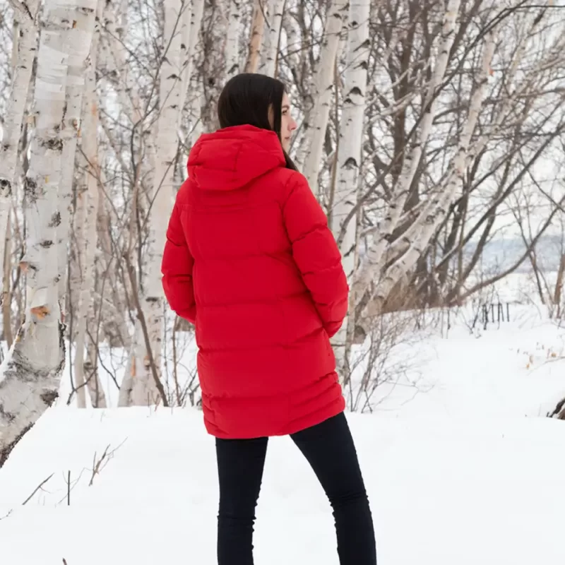 Model wearing winter jacket COCOON pekin on a walk in the woods